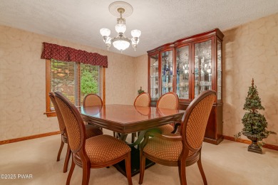 Set on 1.46 acres in Tanglwood Lakes, this 3,310-SF PRIVATE on Paupack Hills Golf and Country Club in Pennsylvania - for sale on GolfHomes.com, golf home, golf lot