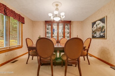 Set on 1.46 acres in Tanglwood Lakes, this 3,310-SF PRIVATE on Paupack Hills Golf and Country Club in Pennsylvania - for sale on GolfHomes.com, golf home, golf lot
