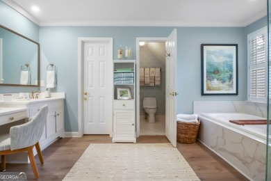 Tucked into a quiet cul-de-sac in sought-after Windward, this on The Golf Club of Georgia in Georgia - for sale on GolfHomes.com, golf home, golf lot