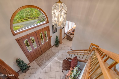 Set on 1.46 acres in Tanglwood Lakes, this 3,310-SF PRIVATE on Paupack Hills Golf and Country Club in Pennsylvania - for sale on GolfHomes.com, golf home, golf lot