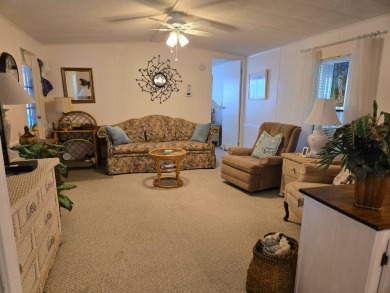 This immaculate, well maintained 2/2 manufactured home is a must on Lake Henry Golf Club in Florida - for sale on GolfHomes.com, golf home, golf lot