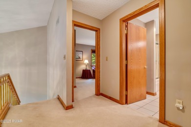 Set on 1.46 acres in Tanglwood Lakes, this 3,310-SF PRIVATE on Paupack Hills Golf and Country Club in Pennsylvania - for sale on GolfHomes.com, golf home, golf lot