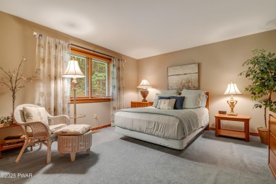 Set on 1.46 acres in Tanglwood Lakes, this 3,310-SF PRIVATE on Paupack Hills Golf and Country Club in Pennsylvania - for sale on GolfHomes.com, golf home, golf lot