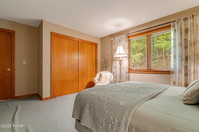 Set on 1.46 acres in Tanglwood Lakes, this 3,310-SF PRIVATE on Paupack Hills Golf and Country Club in Pennsylvania - for sale on GolfHomes.com, golf home, golf lot