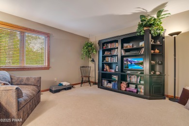 Set on 1.46 acres in Tanglwood Lakes, this 3,310-SF PRIVATE on Paupack Hills Golf and Country Club in Pennsylvania - for sale on GolfHomes.com, golf home, golf lot
