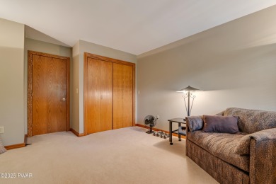 Set on 1.46 acres in Tanglwood Lakes, this 3,310-SF PRIVATE on Paupack Hills Golf and Country Club in Pennsylvania - for sale on GolfHomes.com, golf home, golf lot