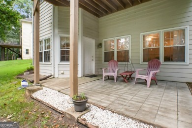 Tucked into a quiet cul-de-sac in sought-after Windward, this on The Golf Club of Georgia in Georgia - for sale on GolfHomes.com, golf home, golf lot