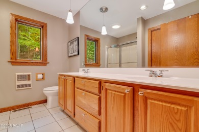 Set on 1.46 acres in Tanglwood Lakes, this 3,310-SF PRIVATE on Paupack Hills Golf and Country Club in Pennsylvania - for sale on GolfHomes.com, golf home, golf lot