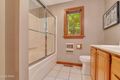 Set on 1.46 acres in Tanglwood Lakes, this 3,310-SF PRIVATE on Paupack Hills Golf and Country Club in Pennsylvania - for sale on GolfHomes.com, golf home, golf lot
