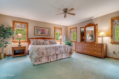 Set on 1.46 acres in Tanglwood Lakes, this 3,310-SF PRIVATE on Paupack Hills Golf and Country Club in Pennsylvania - for sale on GolfHomes.com, golf home, golf lot
