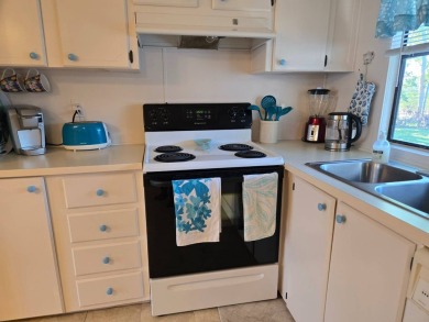 This immaculate, well maintained 2/2 manufactured home is a must on Lake Henry Golf Club in Florida - for sale on GolfHomes.com, golf home, golf lot