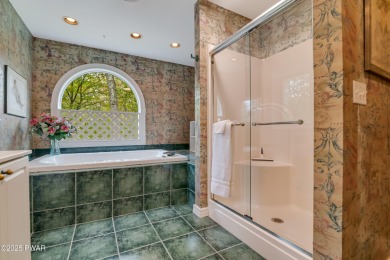 Set on 1.46 acres in Tanglwood Lakes, this 3,310-SF PRIVATE on Paupack Hills Golf and Country Club in Pennsylvania - for sale on GolfHomes.com, golf home, golf lot