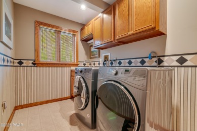 Set on 1.46 acres in Tanglwood Lakes, this 3,310-SF PRIVATE on Paupack Hills Golf and Country Club in Pennsylvania - for sale on GolfHomes.com, golf home, golf lot
