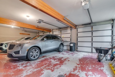 Set on 1.46 acres in Tanglwood Lakes, this 3,310-SF PRIVATE on Paupack Hills Golf and Country Club in Pennsylvania - for sale on GolfHomes.com, golf home, golf lot