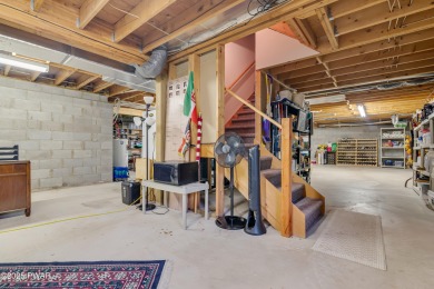 Set on 1.46 acres in Tanglwood Lakes, this 3,310-SF PRIVATE on Paupack Hills Golf and Country Club in Pennsylvania - for sale on GolfHomes.com, golf home, golf lot