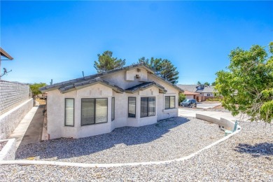 Welcome to 12411 Spring Valley Parkway, located in the highly on Spring Valley Lake Country Club in California - for sale on GolfHomes.com, golf home, golf lot