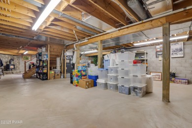 Set on 1.46 acres in Tanglwood Lakes, this 3,310-SF PRIVATE on Paupack Hills Golf and Country Club in Pennsylvania - for sale on GolfHomes.com, golf home, golf lot