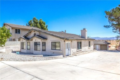 Welcome to 12411 Spring Valley Parkway, located in the highly on Spring Valley Lake Country Club in California - for sale on GolfHomes.com, golf home, golf lot