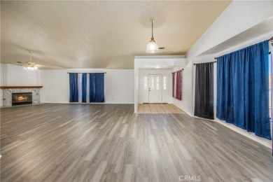 Welcome to 12411 Spring Valley Parkway, located in the highly on Spring Valley Lake Country Club in California - for sale on GolfHomes.com, golf home, golf lot