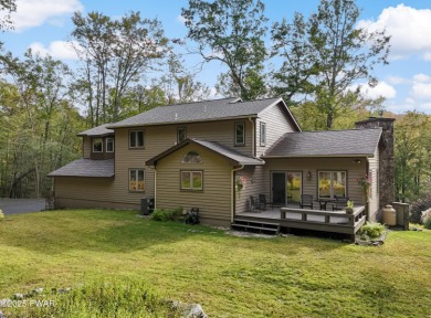 Set on 1.46 acres in Tanglwood Lakes, this 3,310-SF PRIVATE on Paupack Hills Golf and Country Club in Pennsylvania - for sale on GolfHomes.com, golf home, golf lot
