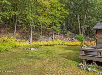 Set on 1.46 acres in Tanglwood Lakes, this 3,310-SF PRIVATE on Paupack Hills Golf and Country Club in Pennsylvania - for sale on GolfHomes.com, golf home, golf lot