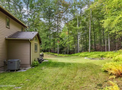 Set on 1.46 acres in Tanglwood Lakes, this 3,310-SF PRIVATE on Paupack Hills Golf and Country Club in Pennsylvania - for sale on GolfHomes.com, golf home, golf lot