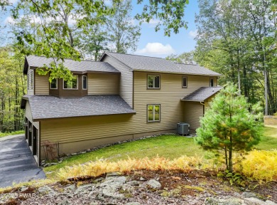 Set on 1.46 acres in Tanglwood Lakes, this 3,310-SF PRIVATE on Paupack Hills Golf and Country Club in Pennsylvania - for sale on GolfHomes.com, golf home, golf lot