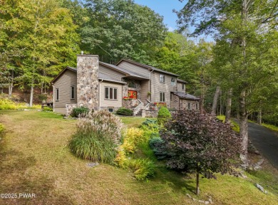 Set on 1.46 acres in Tanglwood Lakes, this 3,310-SF PRIVATE on Paupack Hills Golf and Country Club in Pennsylvania - for sale on GolfHomes.com, golf home, golf lot