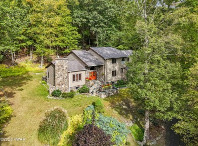 Set on 1.46 acres in Tanglwood Lakes, this 3,310-SF PRIVATE on Paupack Hills Golf and Country Club in Pennsylvania - for sale on GolfHomes.com, golf home, golf lot