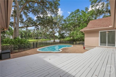 This beautifully updated home in The Landings offers privacy on The Landings Club - Palmetto in Georgia - for sale on GolfHomes.com, golf home, golf lot