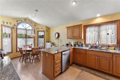 The spacious kitchen is ideal for entertaining, and a cozy gas on Edinburgh USA in Minnesota - for sale on GolfHomes.com, golf home, golf lot