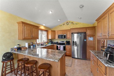 The spacious kitchen is ideal for entertaining, and a cozy gas on Edinburgh USA in Minnesota - for sale on GolfHomes.com, golf home, golf lot