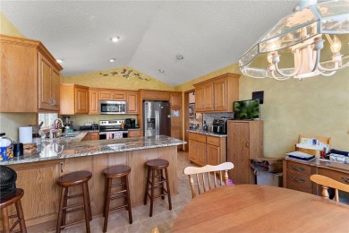 The spacious kitchen is ideal for entertaining, and a cozy gas on Edinburgh USA in Minnesota - for sale on GolfHomes.com, golf home, golf lot