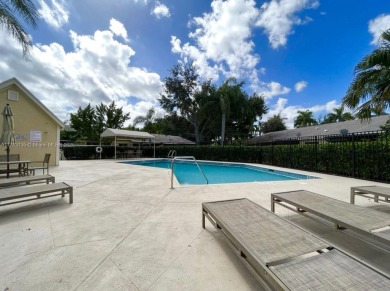 Nestled in Sunrise within the picturesque Fairway Club community on Springtree Country Club in Florida - for sale on GolfHomes.com, golf home, golf lot