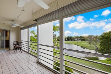 GOLF & WATER VIEWS FROM A 23' LONG BALCONY! UPDATED KITCHEN on Poinciana Golf Club in Florida - for sale on GolfHomes.com, golf home, golf lot