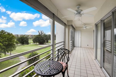 GOLF & WATER VIEWS FROM A 23' LONG BALCONY! UPDATED KITCHEN on Poinciana Golf Club in Florida - for sale on GolfHomes.com, golf home, golf lot