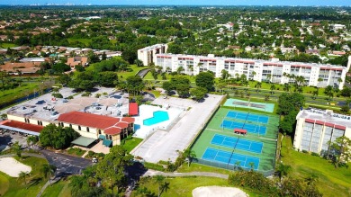 GOLF & WATER VIEWS FROM A 23' LONG BALCONY! UPDATED KITCHEN on Poinciana Golf Club in Florida - for sale on GolfHomes.com, golf home, golf lot