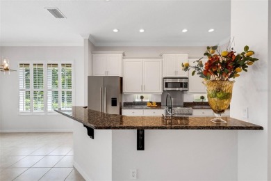 THIS POPULAR DORCHESTER plan home in the Laurel Glen community on Grasslands Golf and Country Club in Florida - for sale on GolfHomes.com, golf home, golf lot
