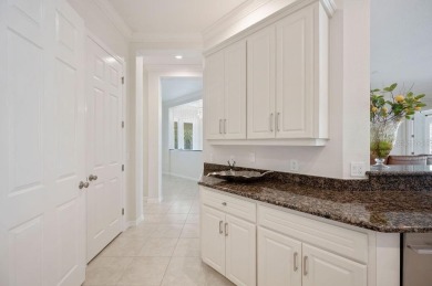 THIS POPULAR DORCHESTER plan home in the Laurel Glen community on Grasslands Golf and Country Club in Florida - for sale on GolfHomes.com, golf home, golf lot