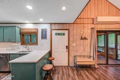 Discover the perfect blend of comfort and serenity in this on The Hideout Golf in Pennsylvania - for sale on GolfHomes.com, golf home, golf lot