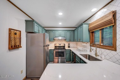 Discover the perfect blend of comfort and serenity in this on The Hideout Golf in Pennsylvania - for sale on GolfHomes.com, golf home, golf lot