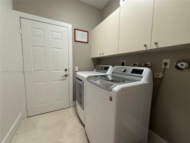 Welcome to this elegant first-floor condominium at The Legends on Weston Hills Country Club in Florida - for sale on GolfHomes.com, golf home, golf lot