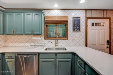 Discover the perfect blend of comfort and serenity in this on The Hideout Golf in Pennsylvania - for sale on GolfHomes.com, golf home, golf lot