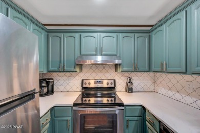 Discover the perfect blend of comfort and serenity in this on The Hideout Golf in Pennsylvania - for sale on GolfHomes.com, golf home, golf lot