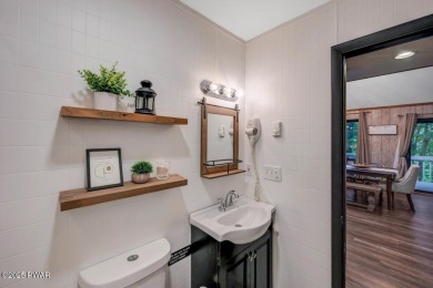 Discover the perfect blend of comfort and serenity in this on The Hideout Golf in Pennsylvania - for sale on GolfHomes.com, golf home, golf lot