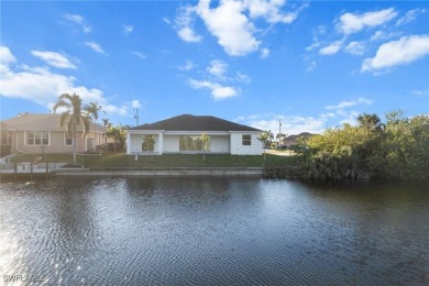 WATERFRONT NEW CONSTRUCTION HOME comes loaded with upgrades on Coral Oaks Golf Course in Florida - for sale on GolfHomes.com, golf home, golf lot