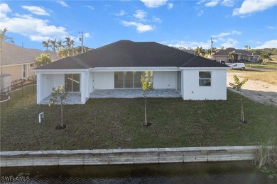 WATERFRONT NEW CONSTRUCTION HOME comes loaded with upgrades on Coral Oaks Golf Course in Florida - for sale on GolfHomes.com, golf home, golf lot