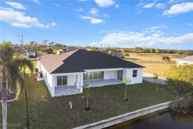 WATERFRONT NEW CONSTRUCTION HOME comes loaded with upgrades on Coral Oaks Golf Course in Florida - for sale on GolfHomes.com, golf home, golf lot