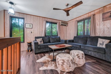 Discover the perfect blend of comfort and serenity in this on The Hideout Golf in Pennsylvania - for sale on GolfHomes.com, golf home, golf lot