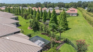 THIS POPULAR DORCHESTER plan home in the Laurel Glen community on Grasslands Golf and Country Club in Florida - for sale on GolfHomes.com, golf home, golf lot